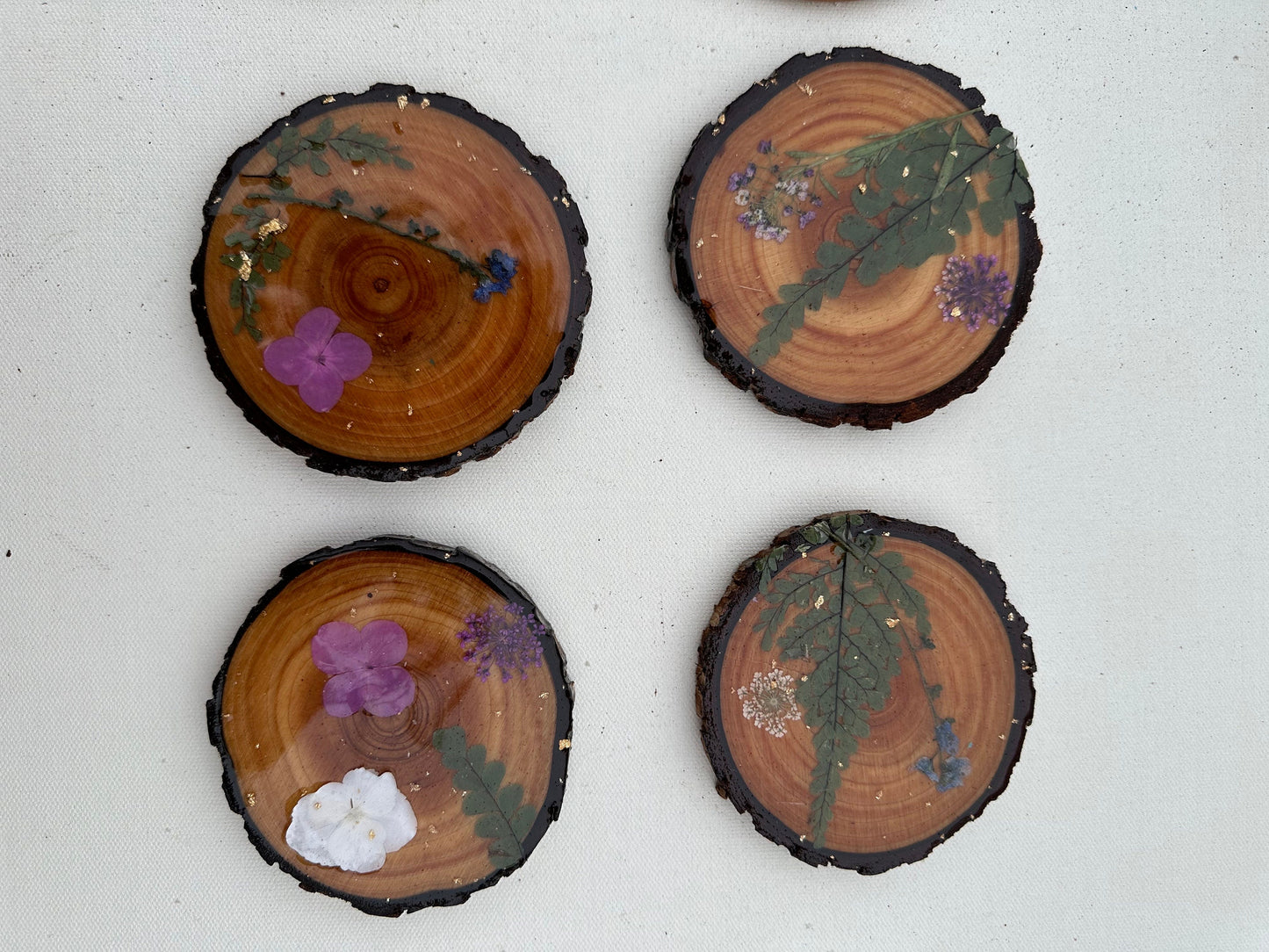 Wood slice coasters with real pressed flowers and leaves ~ custom resin wildflowers gold leaf boho cabin style ~ set of 4 forest rustic